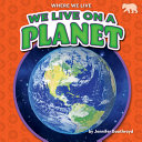 Book cover of WE LIVE ON A PLANET